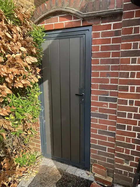 Composite Gate in Front of Modern Home